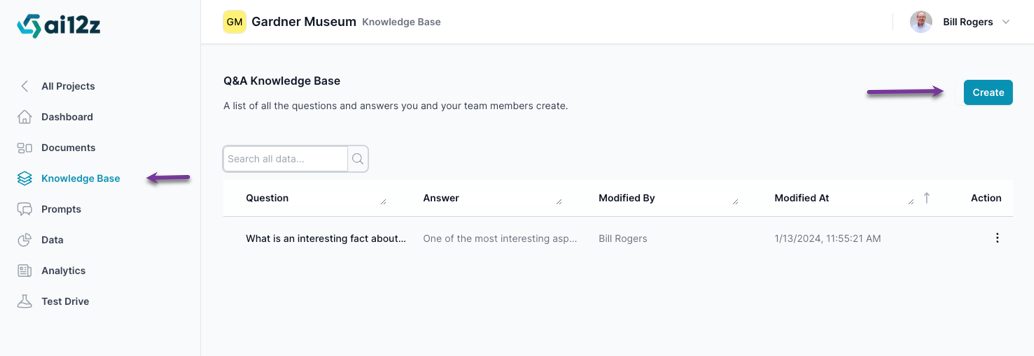 Screenshot of a knowledge base management interface with a navigation bar on the left side and a main content area displaying a table of questions and answers. One entry is visible, showing a question beginning with &#39;What is an interesting fact about...&#39; and a partially visible answer. The entry includes the name of the person who last modified it and the modification date. A &#39;Create&#39; button is present in the top right corner.