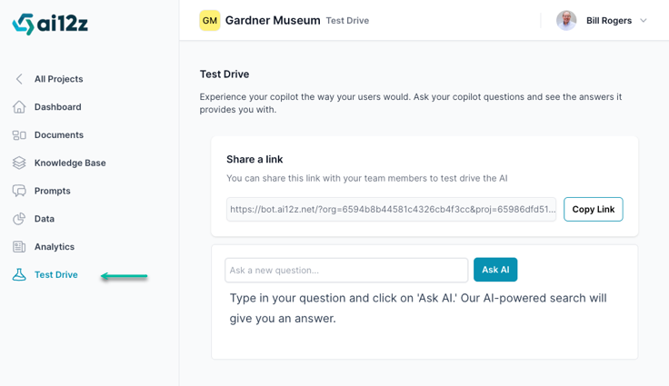 The interface includes a left-hand navigation bar with options such as &#39;All Projects&#39;, &#39;Dashboard&#39;, &#39;Documents&#39;, &#39;Knowledge Base&#39;, &#39;Prompts&#39;, &#39;Data&#39;, &#39;Analytics&#39;, and &#39;Test Drive&#39;, which is currently highlighted. The main area of the screen is dedicated to the &#39;Test Drive&#39; feature where users can experience the AI copilot by asking questions and receiving answers. There&#39;s a section titled &#39;Share a link&#39; with a URL provided and a &#39;Copy Link&#39; button next to it. Below, there is an input field labeled &#39;Ask a new question...&#39; with an &#39;Ask AI&#39; button, accompanied by a prompt instructing users to type in their question and click the button for an AI-powered search answer.